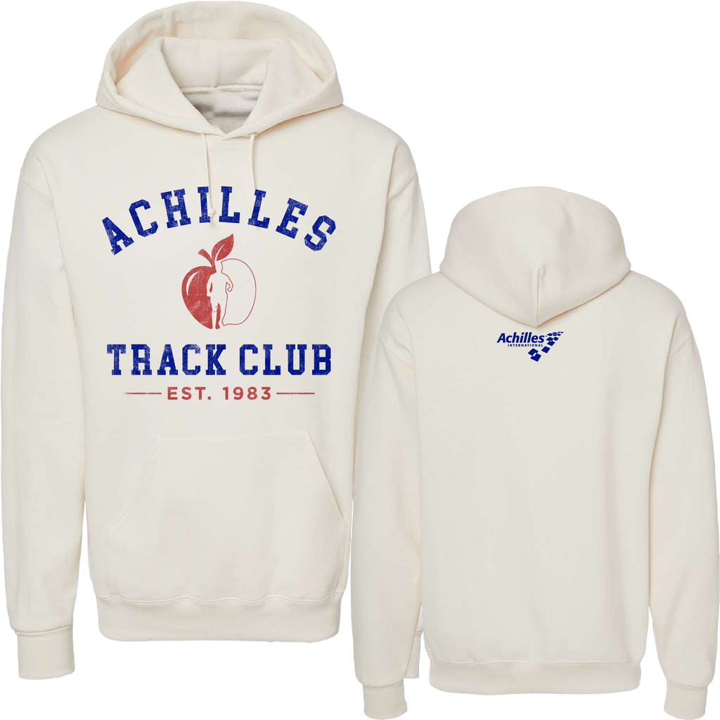A cream pullover hoodie shown from both front and back. The front features a graphic with the text 'ACHILLES TRACK CLUB' in blue and a red apple logo in the center with a running silhouette, with 'EST.1983 below.' The back features a small blue 'Achilles International' logo in the upper center neck.